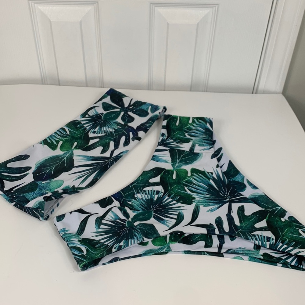 2 pc. Green/white flowered bikini has no tags. Bando top high waisted bottoms